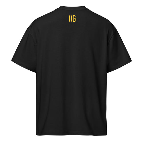 Black men's box tee featuring Alpha Phi Alpha ape face design by Grizzly Bear Graphics, displayed from the back.